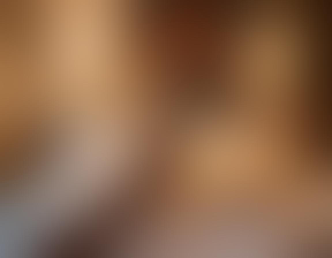 A tastefully designed cozy bedroom setting, featuring soft lighting and romantic decor, with intimate symbols like handcuffs and candles subtly incorporated. In the foreground, a couple’s hands intertwine, depicting trust and adventure, while hints of playful exploration are suggested by tasteful art on the walls. The atmosphere radiates warmth and connection. vibrant colors. super-realistic. soft focus.